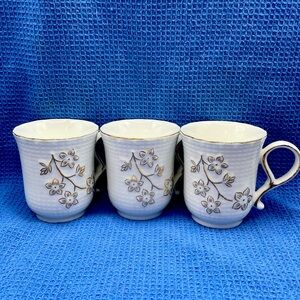 Set of 3 white w/gold trim tea cups